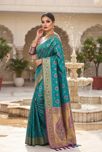 Teal blue and gold patterned saree.